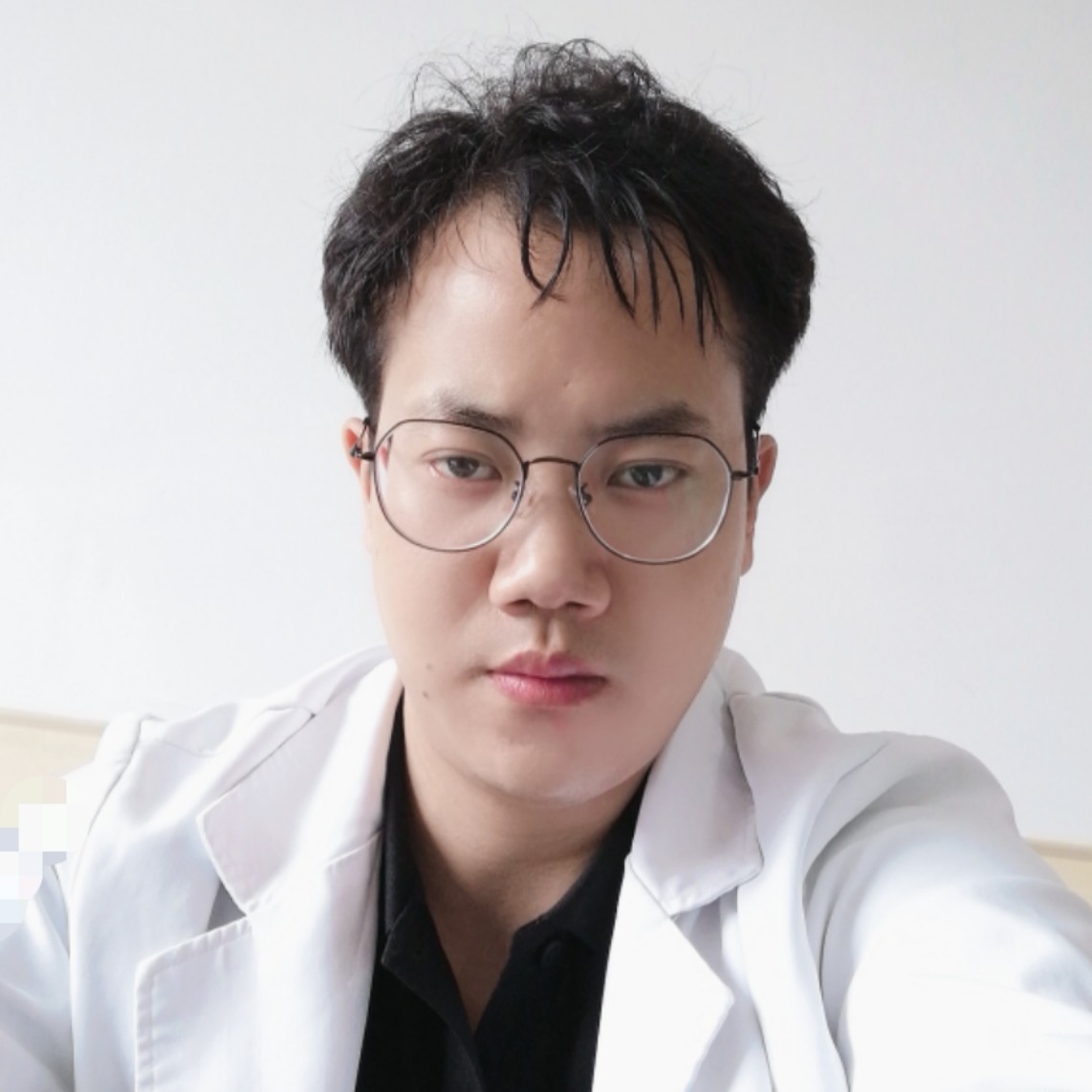 邱健